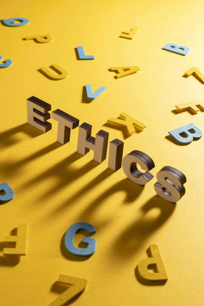 The word "ethics" written like artwork, with other letters floating around it